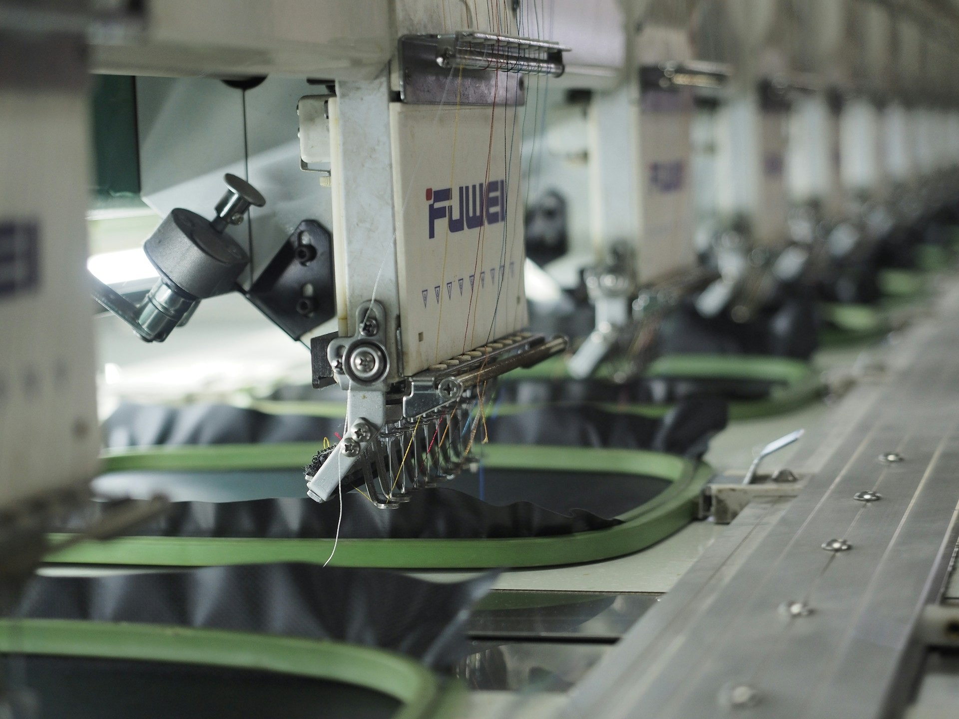 Professional garment auditor performing Inline Inspection in an Indonesian apparel plant